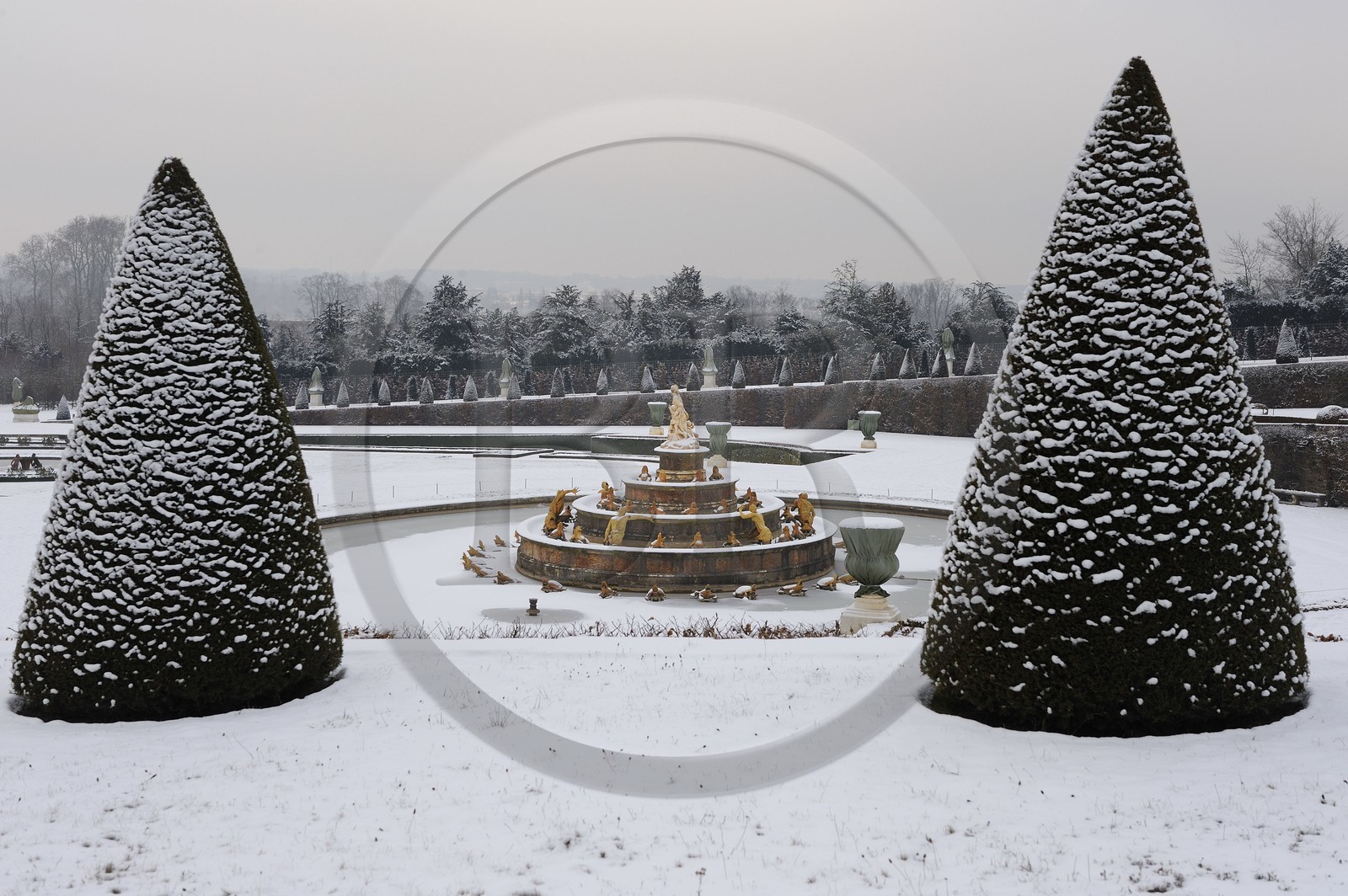France, Yvelines, snow covered park of the Chateau de Versailles, listed as World Heritage by UNESCO, the Latona Basin