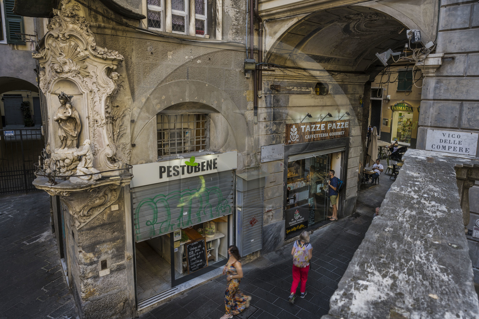 Italy, Liguria, Genoa, alley of the old historic center, shops at the foot of the San Pietro in Banchi church via di San Pietro della Porta on the edge of Piazza Banchi