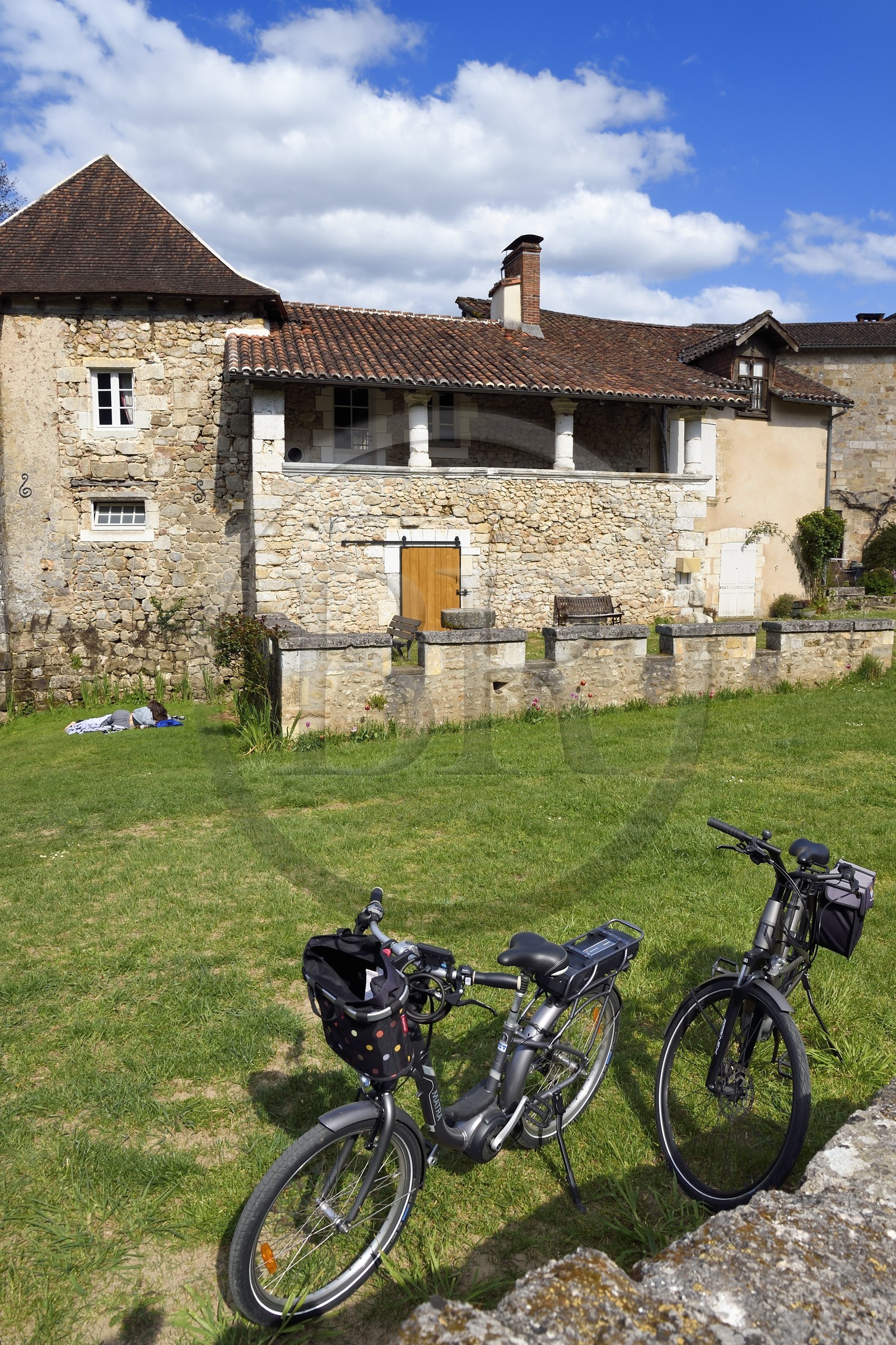 France, Dordogne, Périgord Vert, Saint Jean de Cole labelled Les Plus Beaux Villages de France (The Most Beautiful Villages of France), bikes in front the old abbey mill