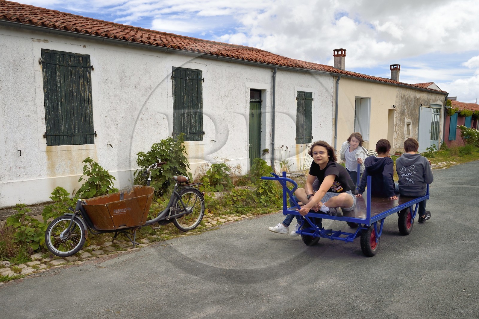France, Charente-Maritime, Ile d'Aix (Aix Island), the bourg, children's games on a cart in rue Marengo