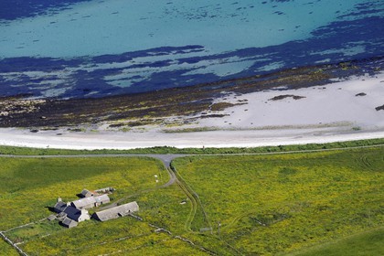 United Kingdom, Scotland, Orkney Islands, Papa Westray Island, farm by the sea and the beach (aerial view)