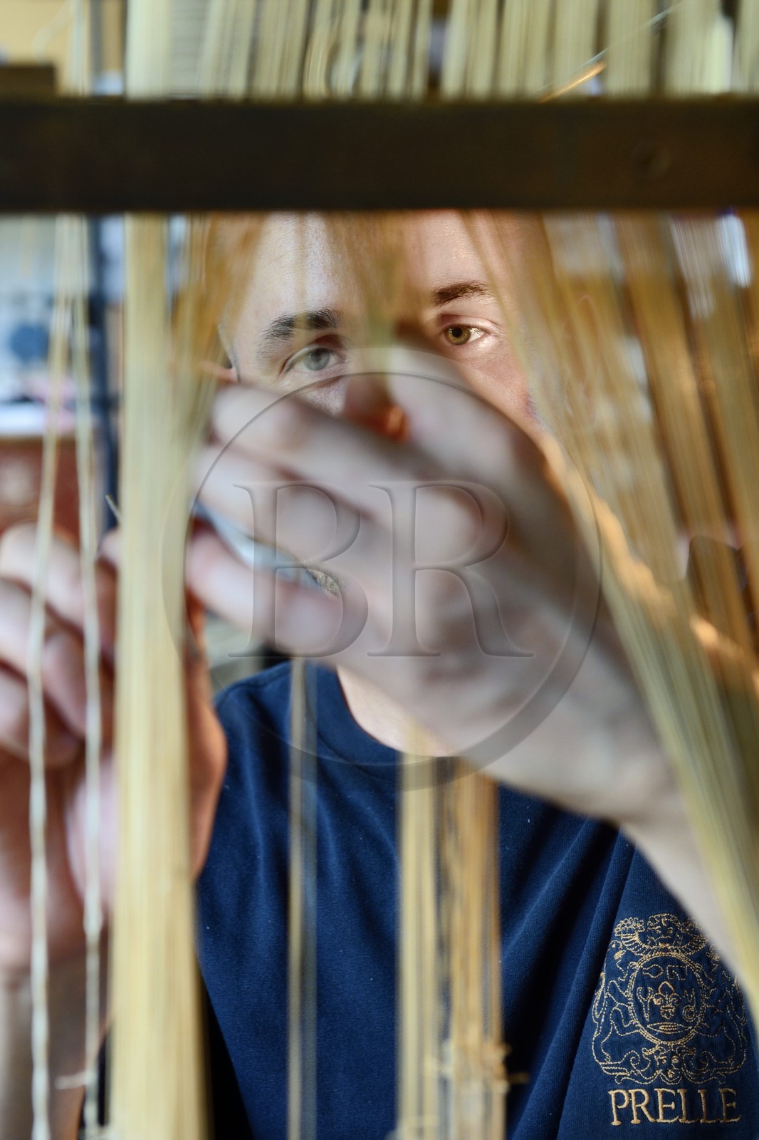 France, Rhone, Lyon, La Croix Rousse District, Silk manufacturer Prelle, silk loom developed by Joseph Marie Jacquard called Jacquard loom, the canut (lyonnais silk worker) Sebastien preparing his loom