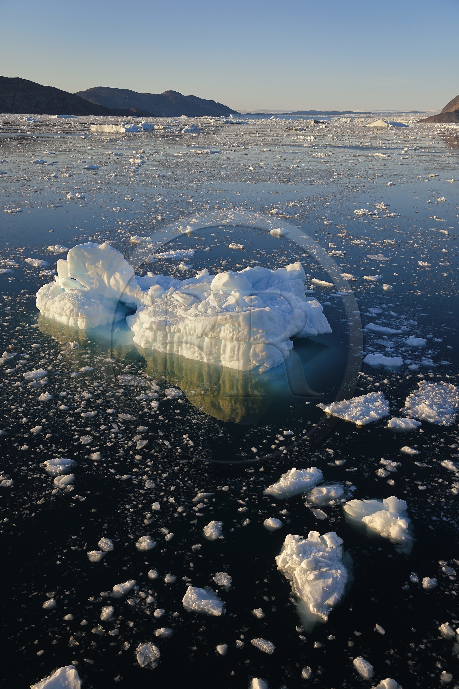 Greenland, west coast, Disko Bay, icebergs in Quervain Bay, the Kangilerngata sermia next to the Eqip Sermia Glacier (Eqi Glacier) in the background