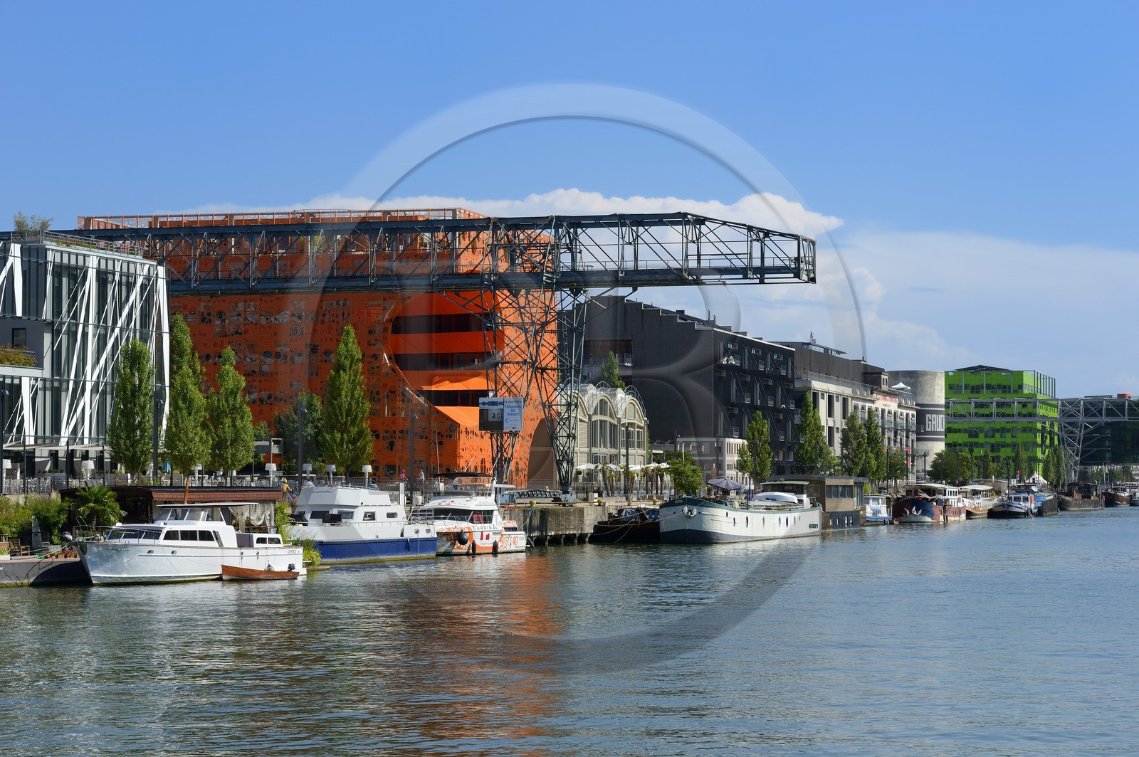 France, Rhone, Lyon, La Confluence new district in the South of the Presqu'ile (Peninsula), Quai Rambaud, the Orange Cube by Dominique Jakob and Brendan MacFarlane architects and the green building of Euronews headquarters in the background