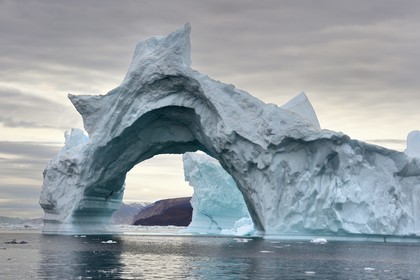 Greenland, North West coast, Baffin Sea, Inglefield Fjord towards Qaanaaq, iceberg forming an arch