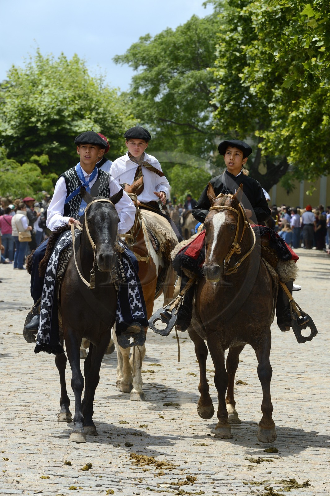 Argentina, Buenos Aires Province, San Antonio de Areco, Tradition Day festival (Dia de Tradicion), very young gauchos on horseback in traditional dress during the parade