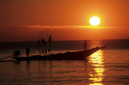 Thailand, Samui islands archipelago, Koh Pha-Ngan island, fishermen small boat on sunset
