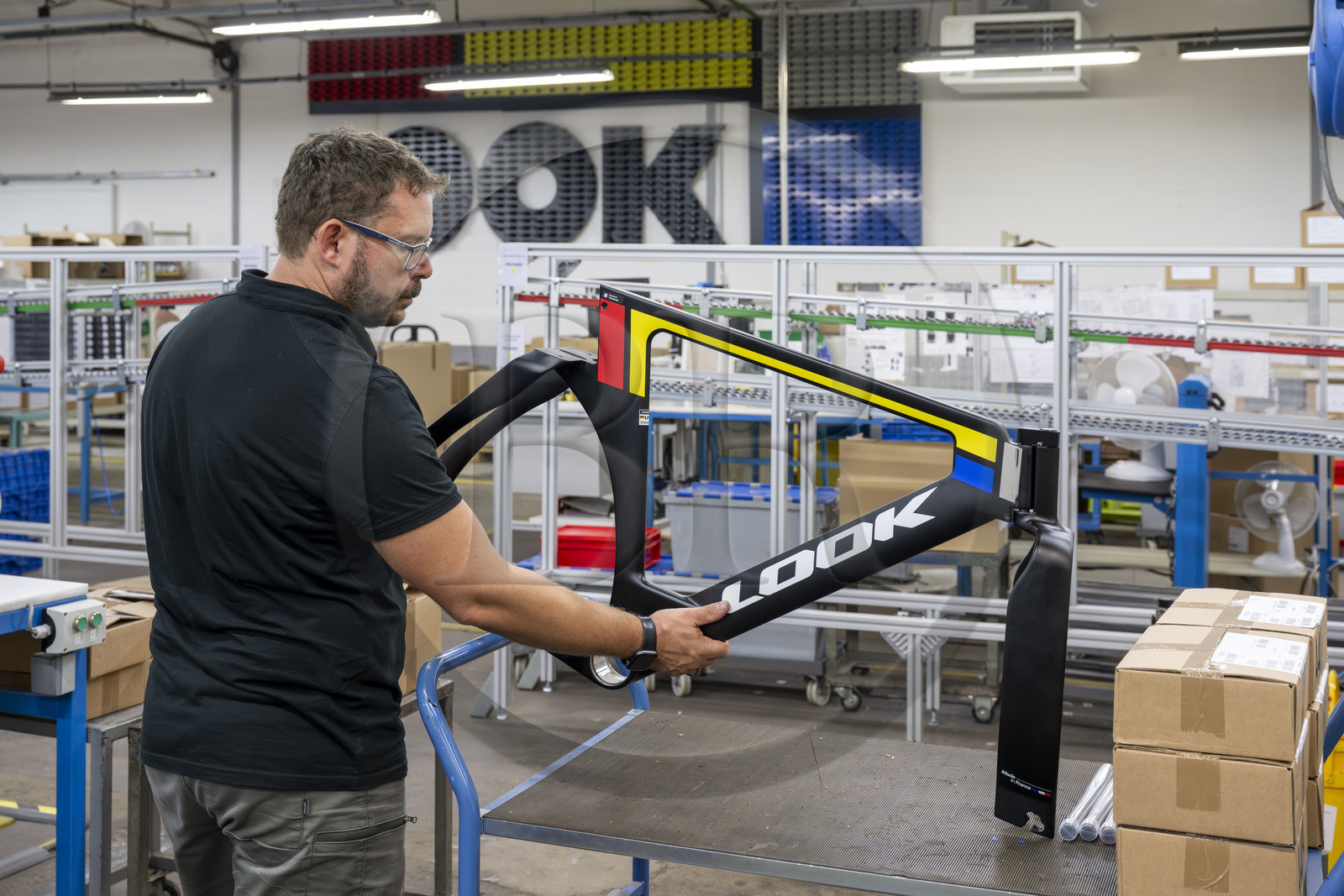 France, Nièvre, Nevers, Look Cycles International company, Event site technician Thomas Millot holds up the frame of the ultra-light carbon LOOK P24 competition bike that allowed Benjamin Thomas to win the gold medal at the Paris 2024 Olympic Games