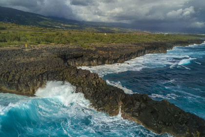France, Ile de la Reunion, L'Etang Salé les Bains, la côte entre Le Gouffre et l'Etang du Gol, roches noires basaltiques d'origine volcanique tourmentées par l'océan (vue aérienne)