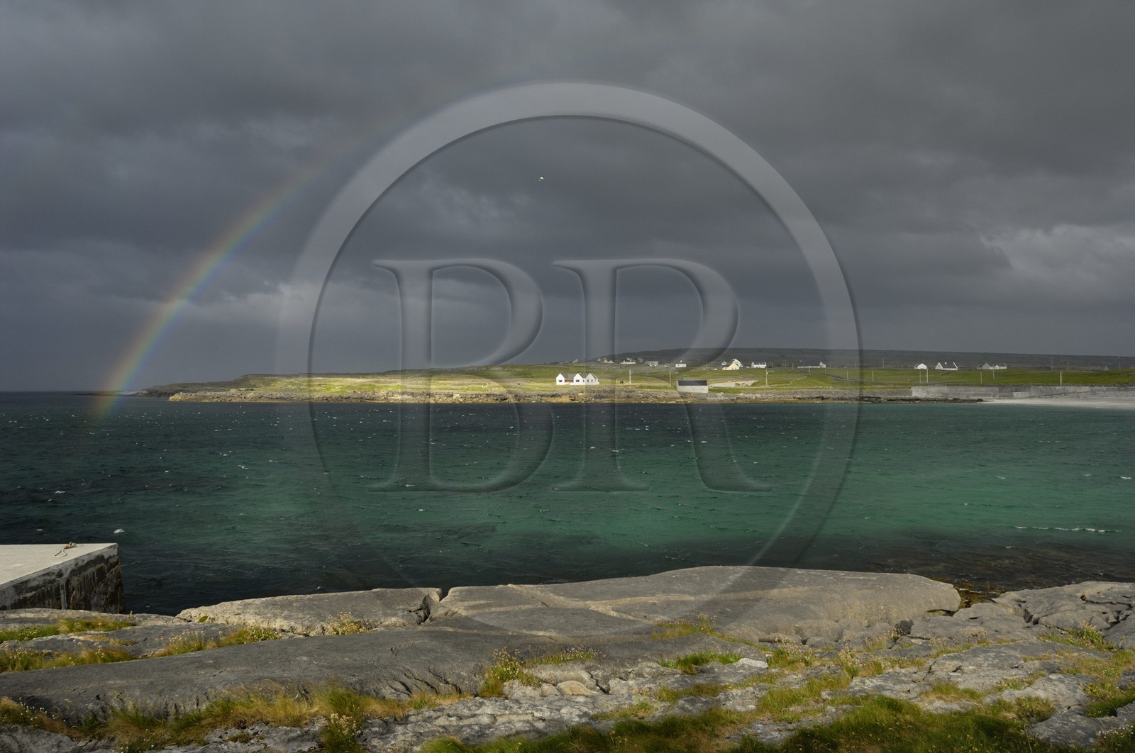 Republic of Ireland, County Galway, Aran Islands, Inishmore, rainbow over the bay of Kilmurvey