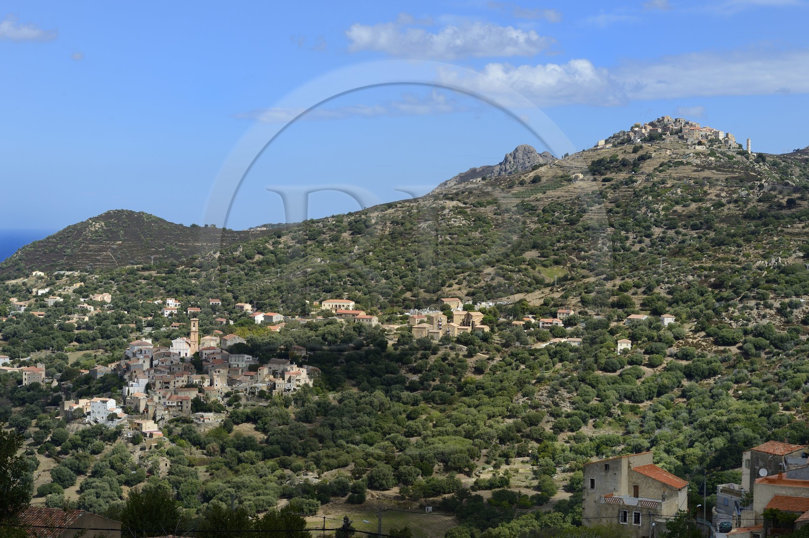 France, Haute Corse, Balagne, village of Aregno left and the perched village of Sant'Antonino in the background