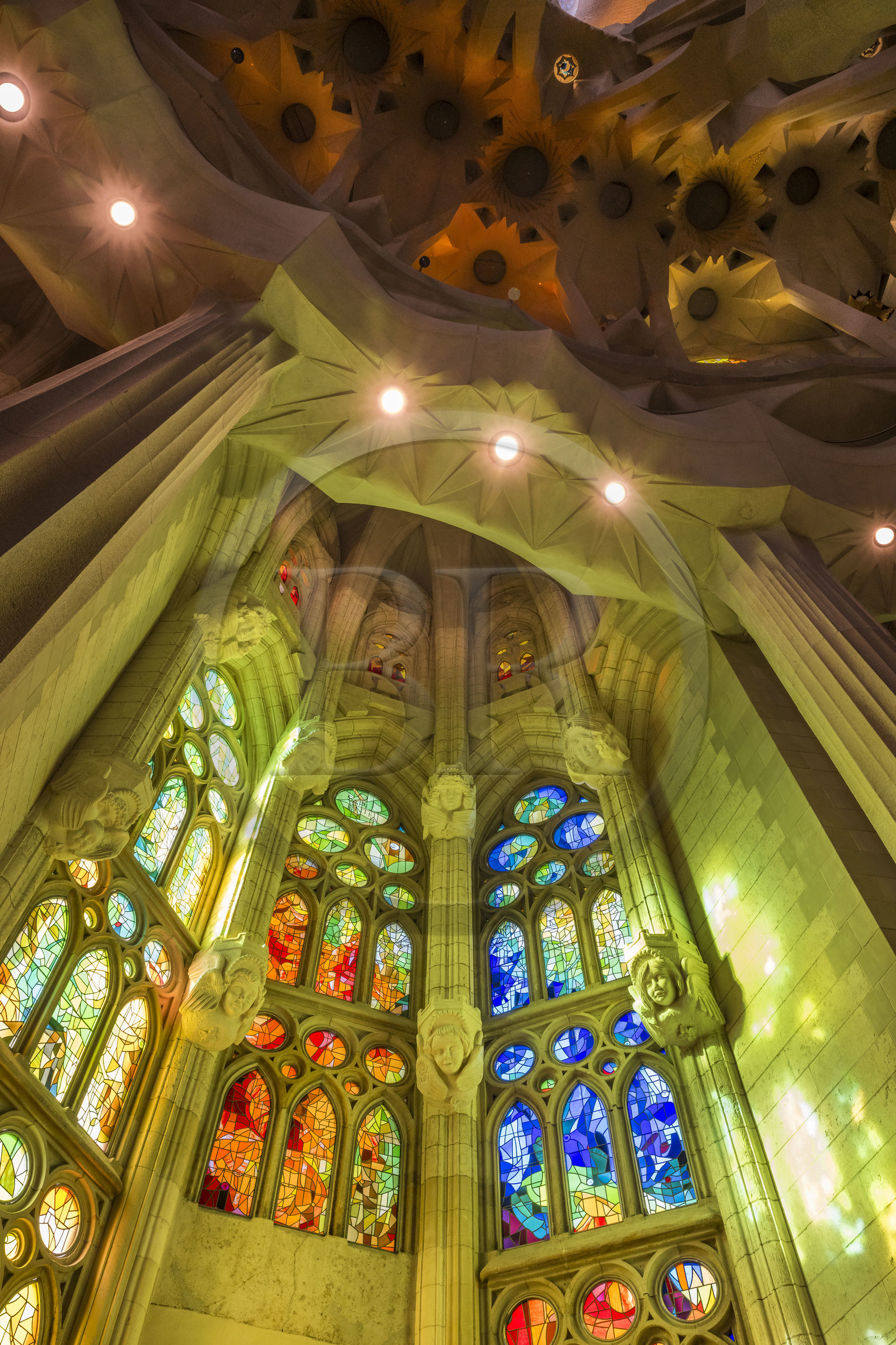 Spain, Catalonia, Barcelona, Eixample district, Sagrada Familia basilica by Catalan modernist architect Antoni Gaudi, listed as a UNESCO World Heritage Site, stained glass windows of the apse above the ambulatory by the Catalan painter and glassmaker Joan Vila-Grau
