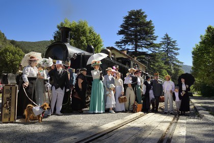 France, Alpes-Maritimes, Puget Theniers, the Train des Pignes historic train, members of the AHVAE (Association d'histoire vivante et de d'archeologie expérimentale) in Belle Epoque costume in front of the steam engine