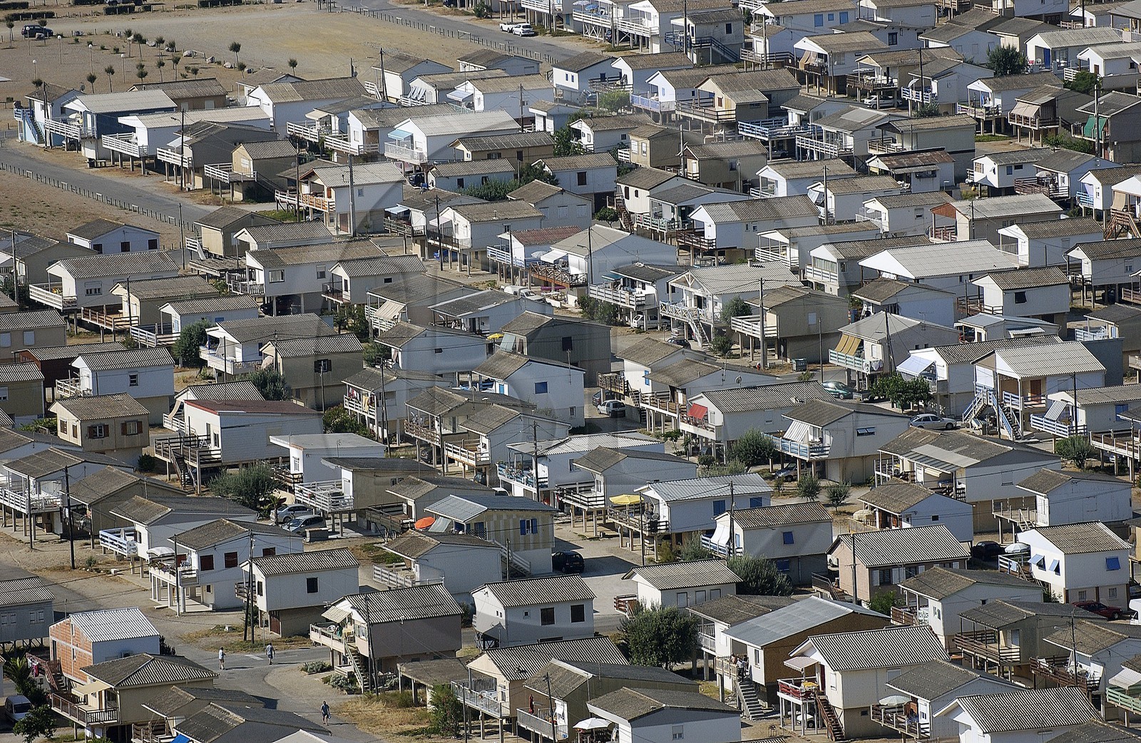 France, Aude, village of Gruissan Plage consists of houses built on piles (aerial view)