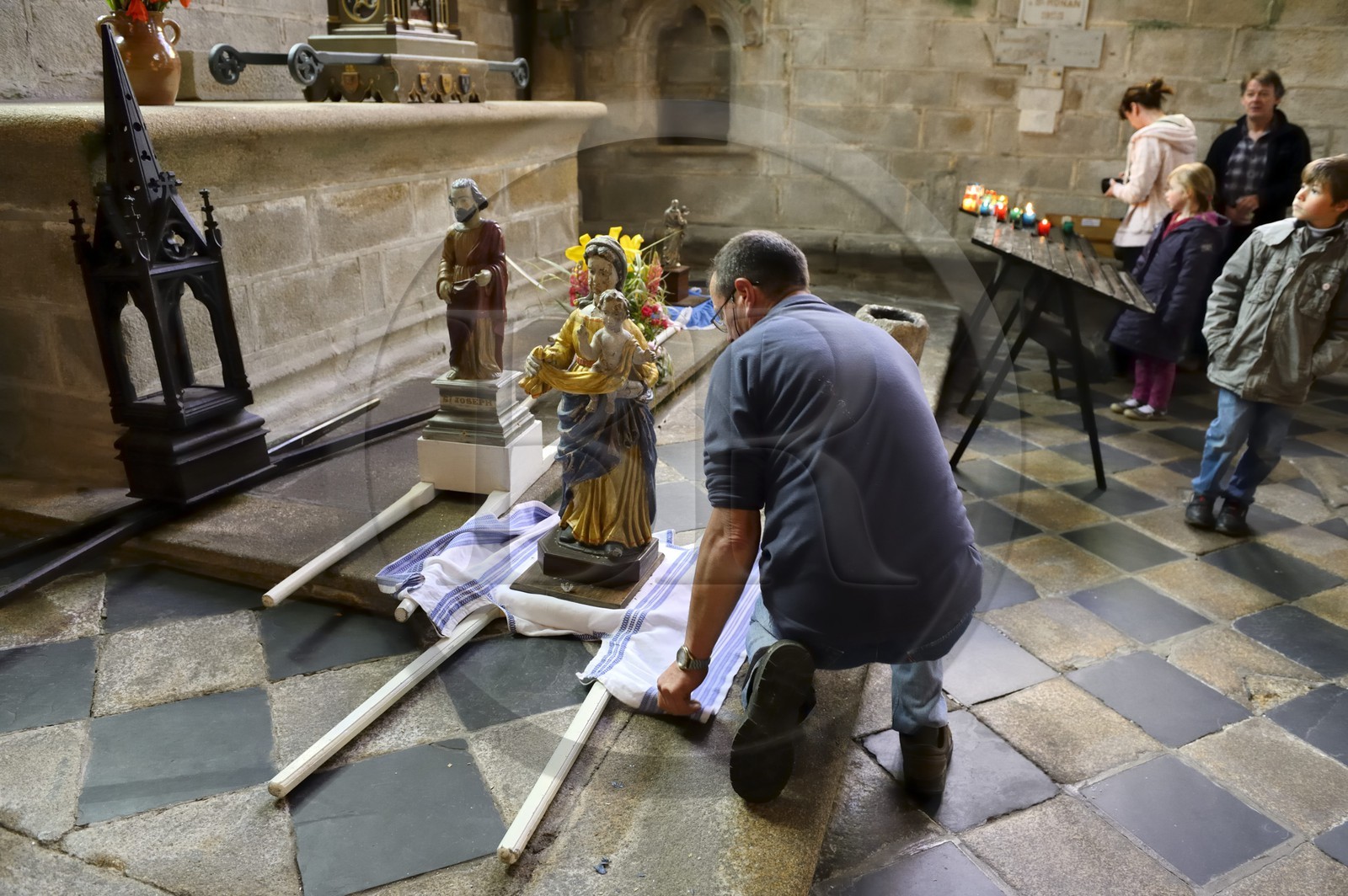 France, Finistere, Locronan, labelled Les plus Beaux Villages de France (The Most Beautiful Villages of France), Saint Ronan church, preparation of a statue of the Virgin for the procession of the Tromenie