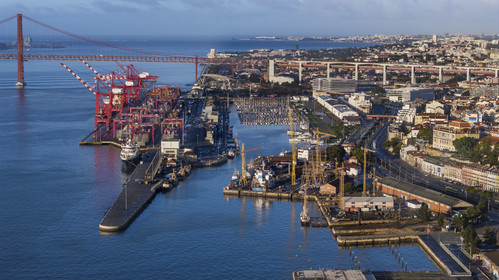 Portugal, Lisbon, Lisbon port and the Doca de Alcantara on the banks of the Tagus, the Ponte 25 de Abril in the background (aerial view)