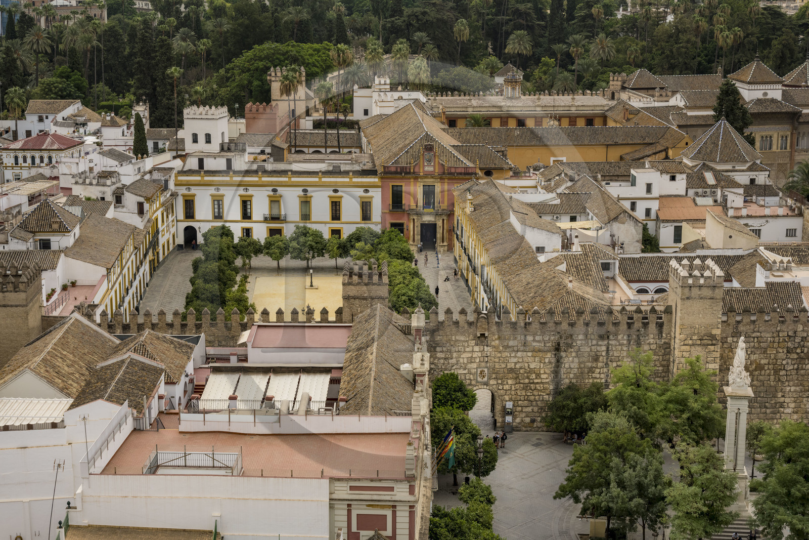 Spain, Andalusia, Seville, plaza del Triunfo, the Alcazar of Seville (Reales Alcazares de Sevilla), listed as World Heritage by UNESCO, surrounded by its walls