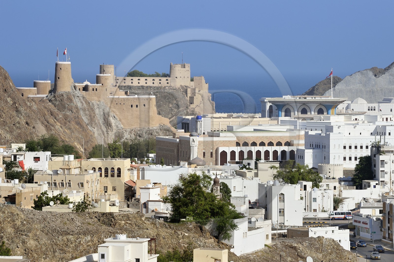 Sultanate of Oman, Muscat, old city of Muscat, the royal palace of Muscat right and the Al-Mirani Fort left