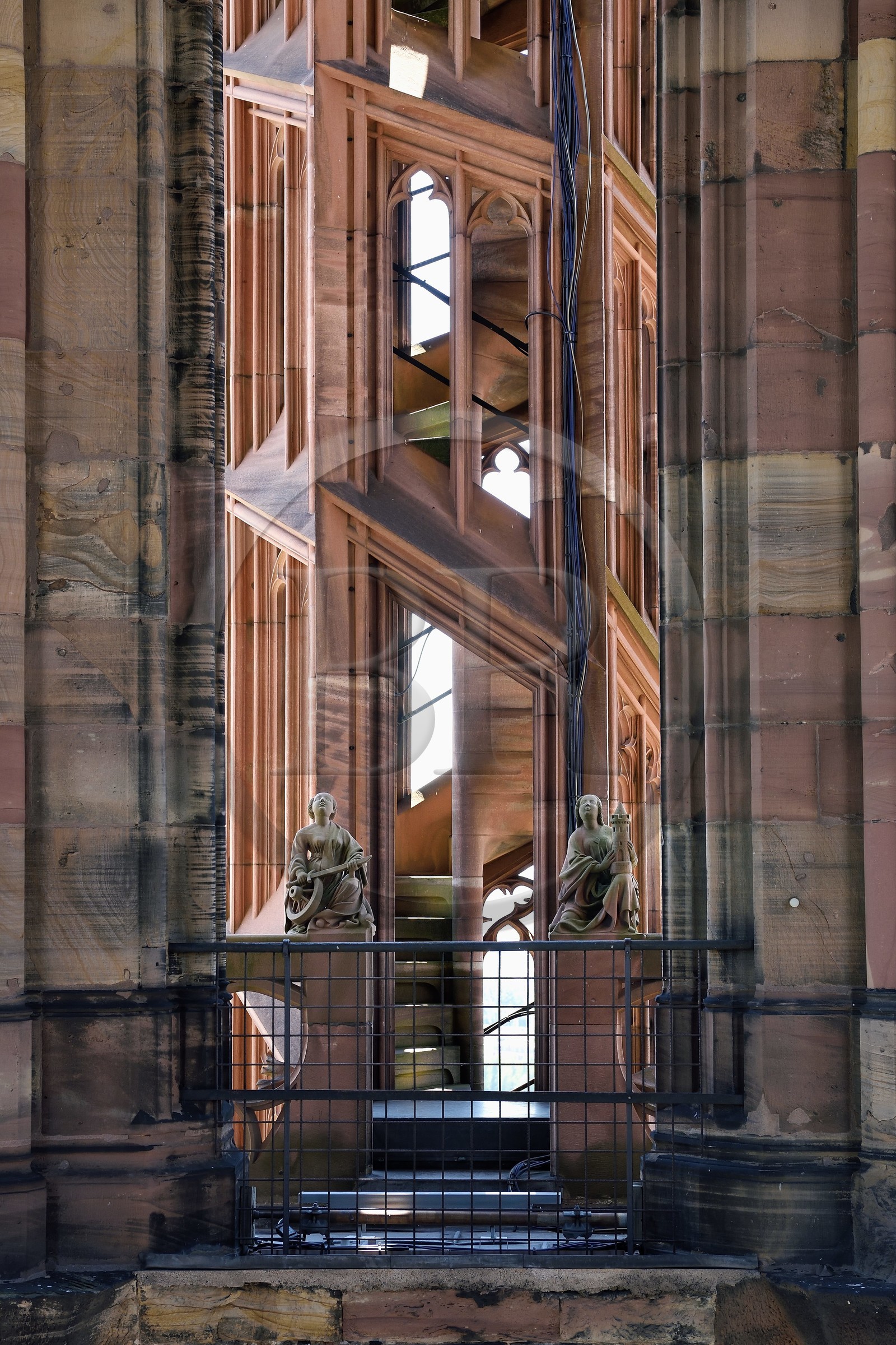 France, Bas Rhin, Strasbourg, old town listed as World Heritage by UNESCO, Notre Dame Cathedral, halfway up each of the four spiral staircases called the Vier Schnecken (four snails), a footbridge connects them to the octagonal tower and there are two statues, here Sainte Catherine and Sainte Barbe