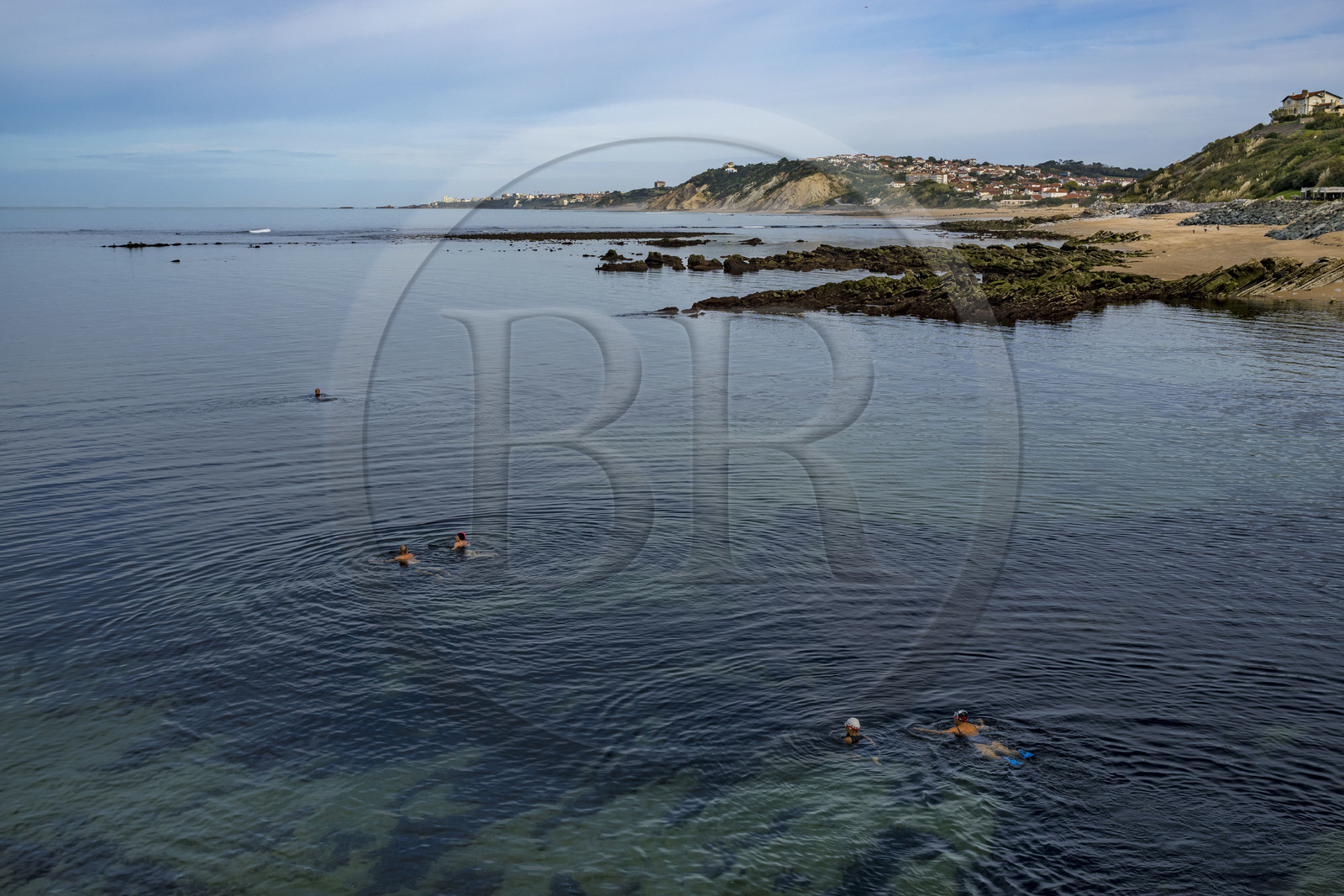 France, Pyrenees Atlantiques, Basque Country coast, Guethary, swimmers at the entrance of the port and the coast towards Biarritz in the background
