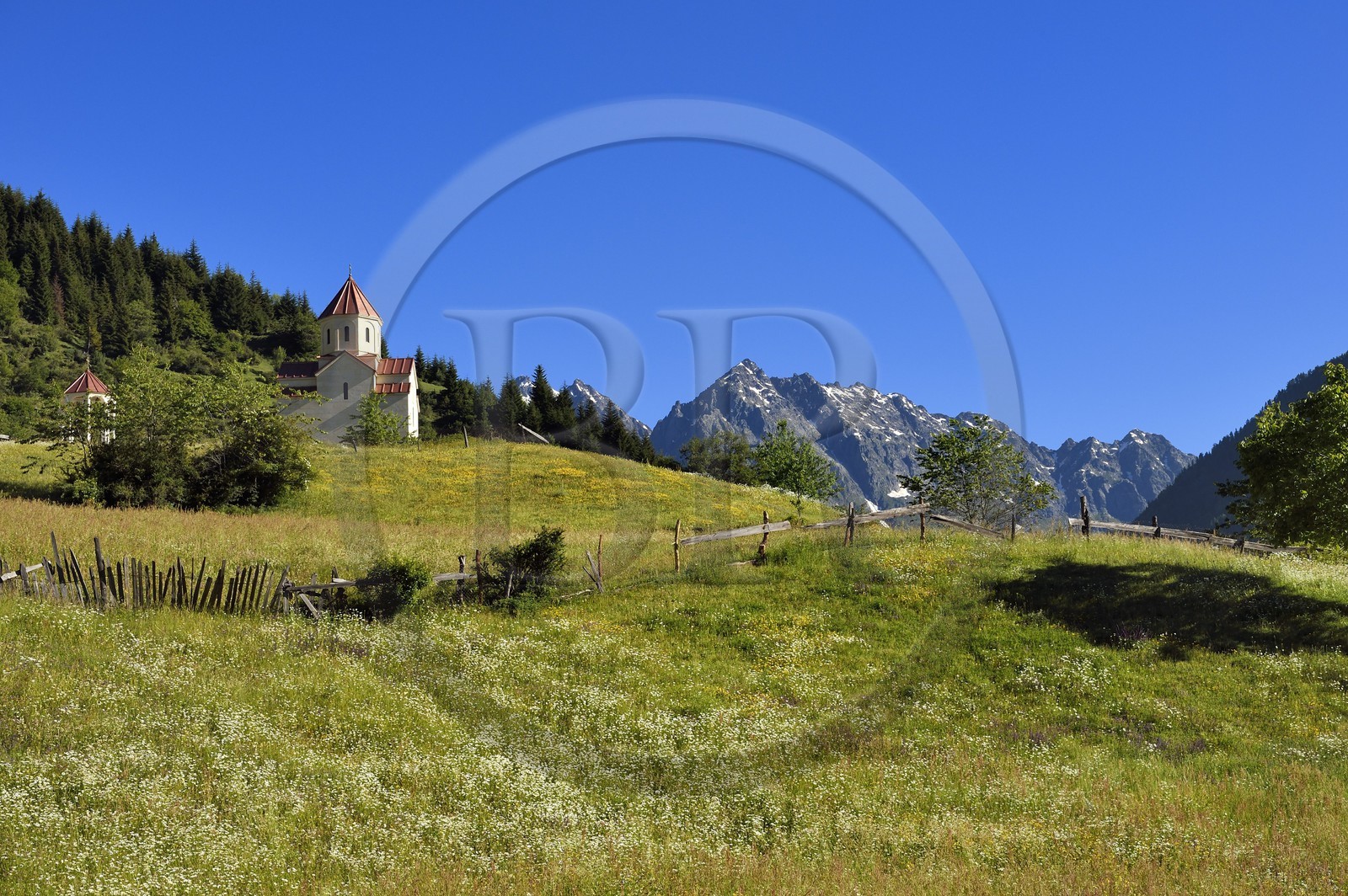 Georgia, Upper Svaneti (Zemo Svaneti), Mestia, orthodox chapel above a meadow on the foothills of Mount Ushba