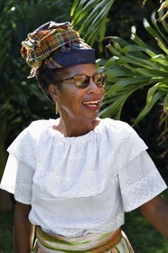 Caribbean, Dominica Island, Grand Fond site in the north of the island, Gillis in traditional Dominica dress after mass
