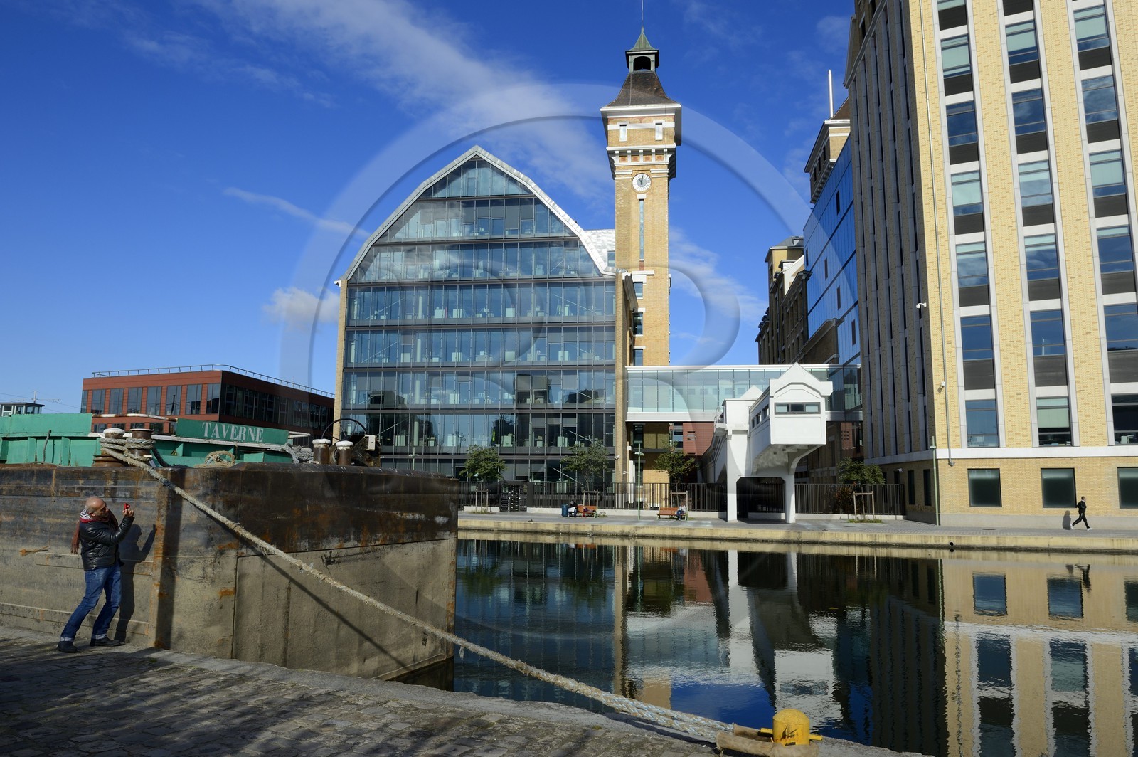 France, Seine Saint Denis, Pantin, Pantin great windmills, former industrial flour-milling created in 1884 and converted into office buildings by the architecs Reichen et Robert for the BNP-Paribas Securities Services, the canal of Ourcq