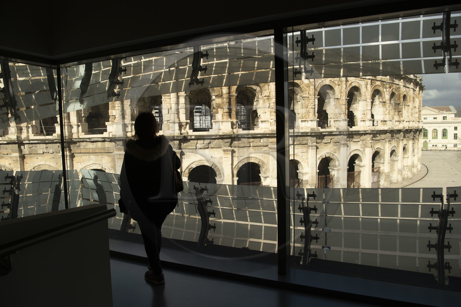 France, Gard, Nimes, Romanity museum (Musée de la Romanite) by architect Elizabeth de Portzamparc, the arena amphitheater faces it