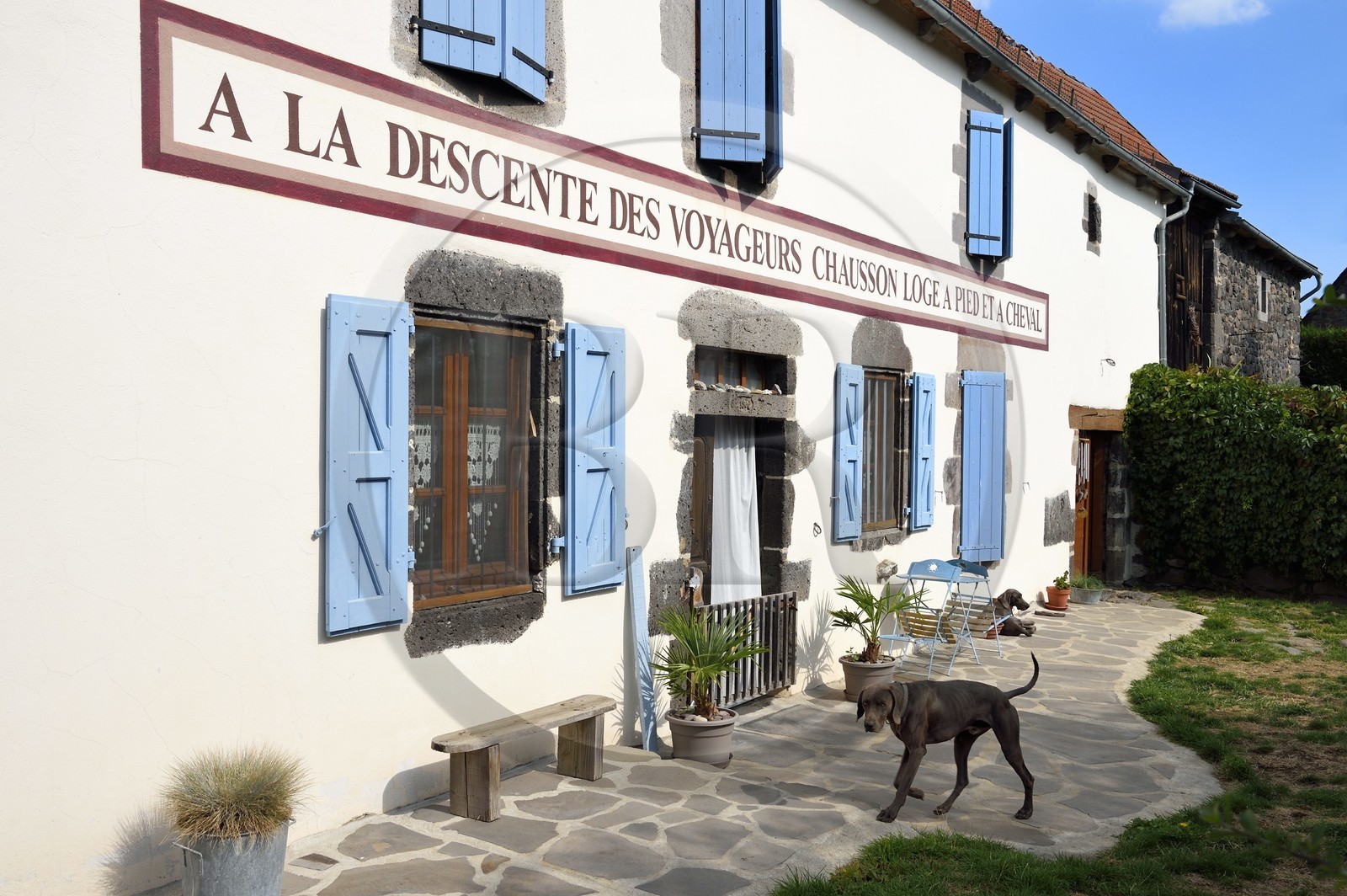 France, Cantal, Parc Naturel Régional des Volcans d'Auvergne (regional nature park of Auvergne volcanoes), step on the Way of St. James to Santiago de Compostela by Via Arverna, Chalinargues, 1806 sign of a former post relay restored identically