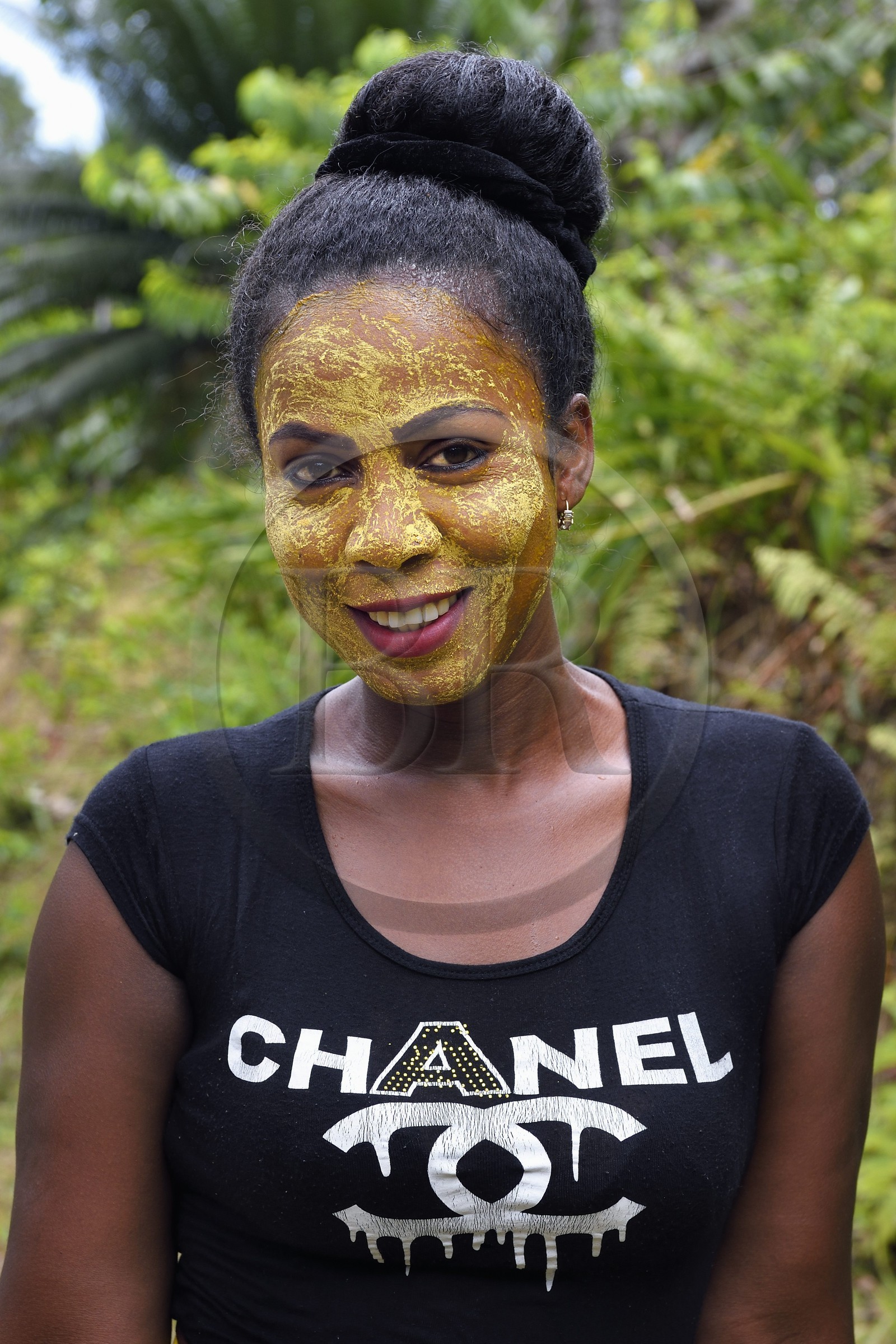 France, Mayotte island (French overseas department), Grande-Terre, Ouangani, Mahorais woman wearing a facial mask with sandalwood (the m'sindzano)