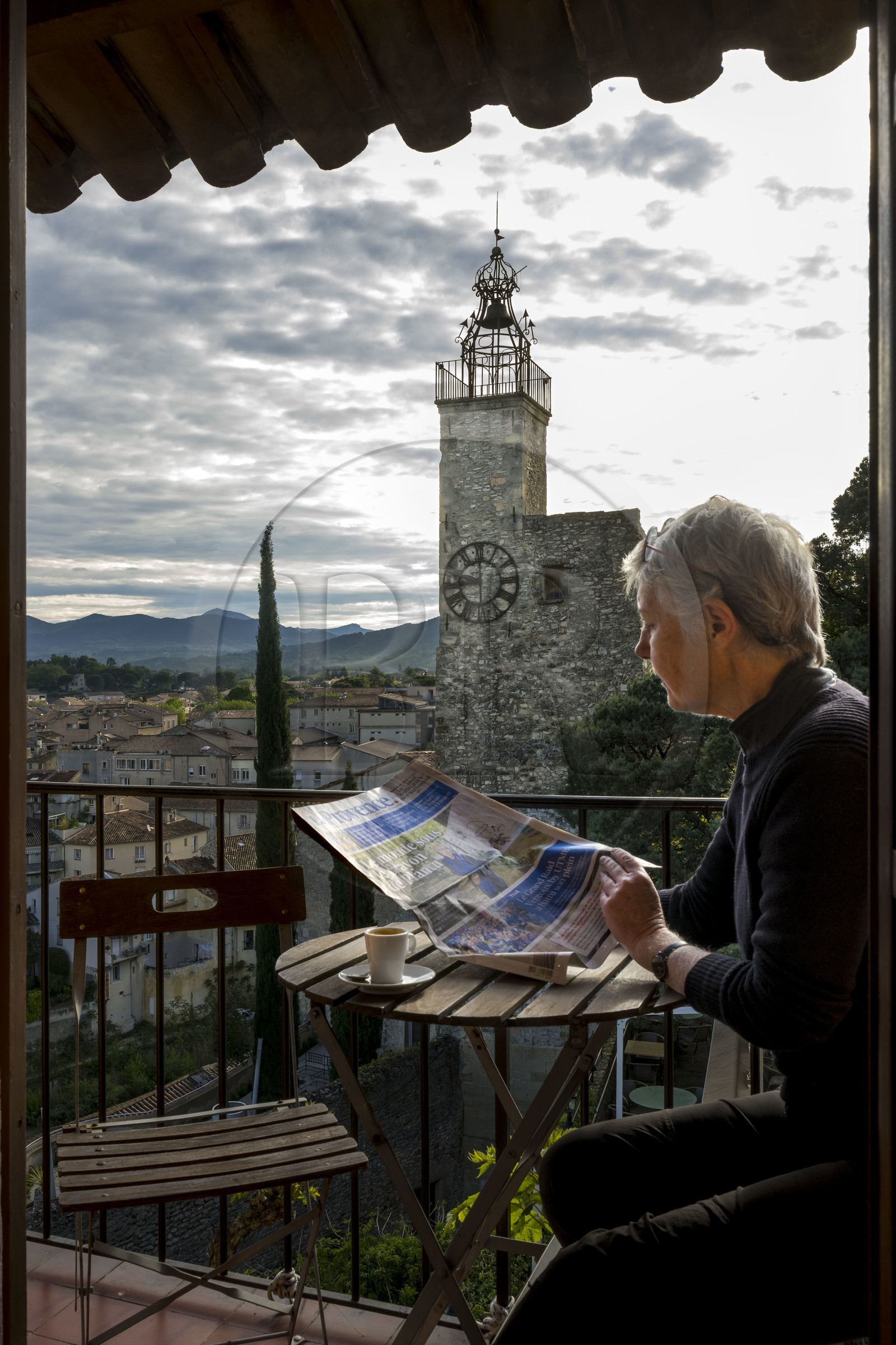 France, Vaucluse, Dentelles de Montmirail mountains,  Vaison la Romaine, the upper town (medieval city), belfry tower from the 14th - 18th century known as the Clock Tower seen from the Hotel du Beffroi