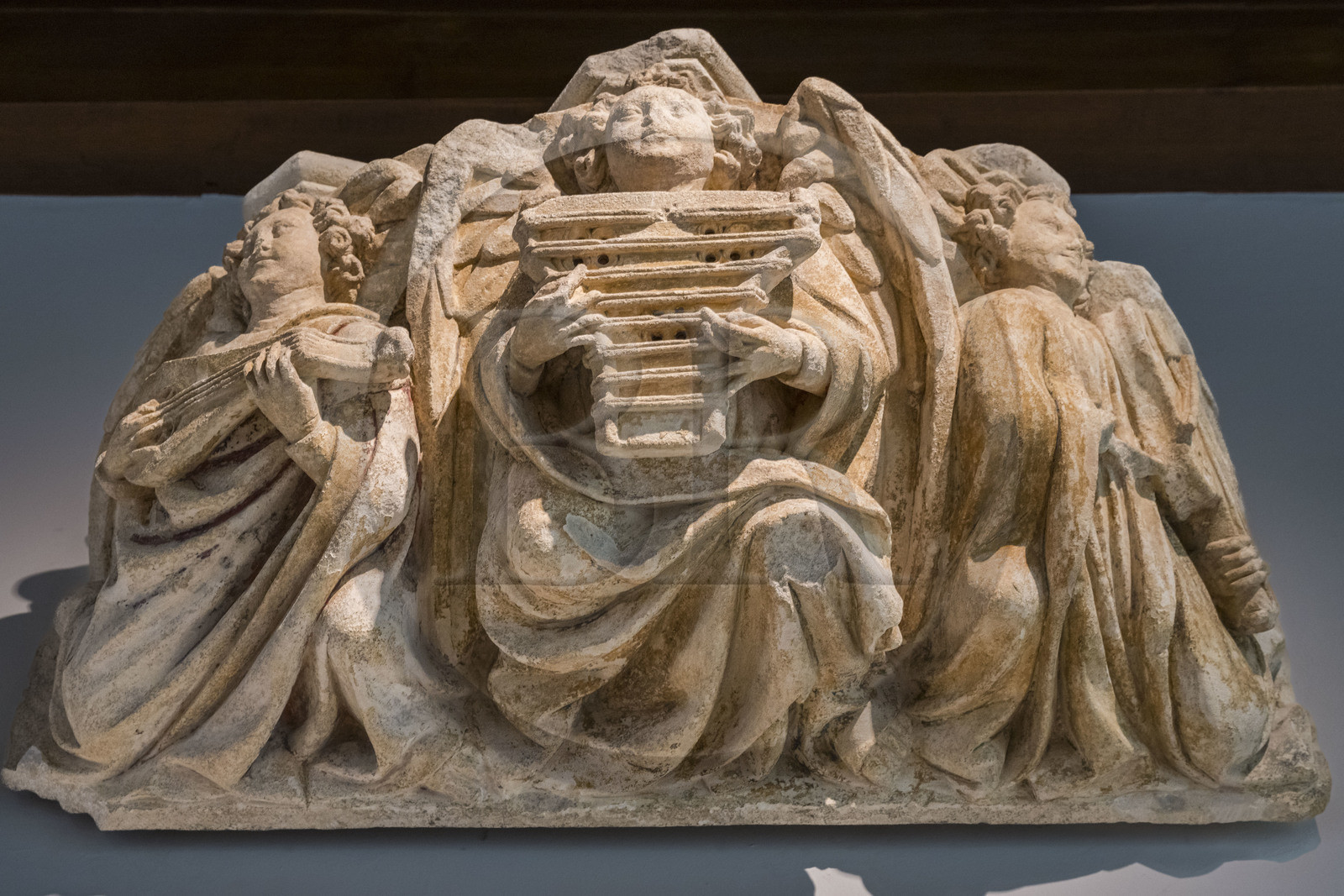 France, Paris, Musée de Cluny - Musée national du Moyen-Age (Middle Ages Museum in the former Hotel de Cluny), Cul-de-lampe representing three musical angels from the Saint-Jean-de-Latran church in Paris, circa 1400