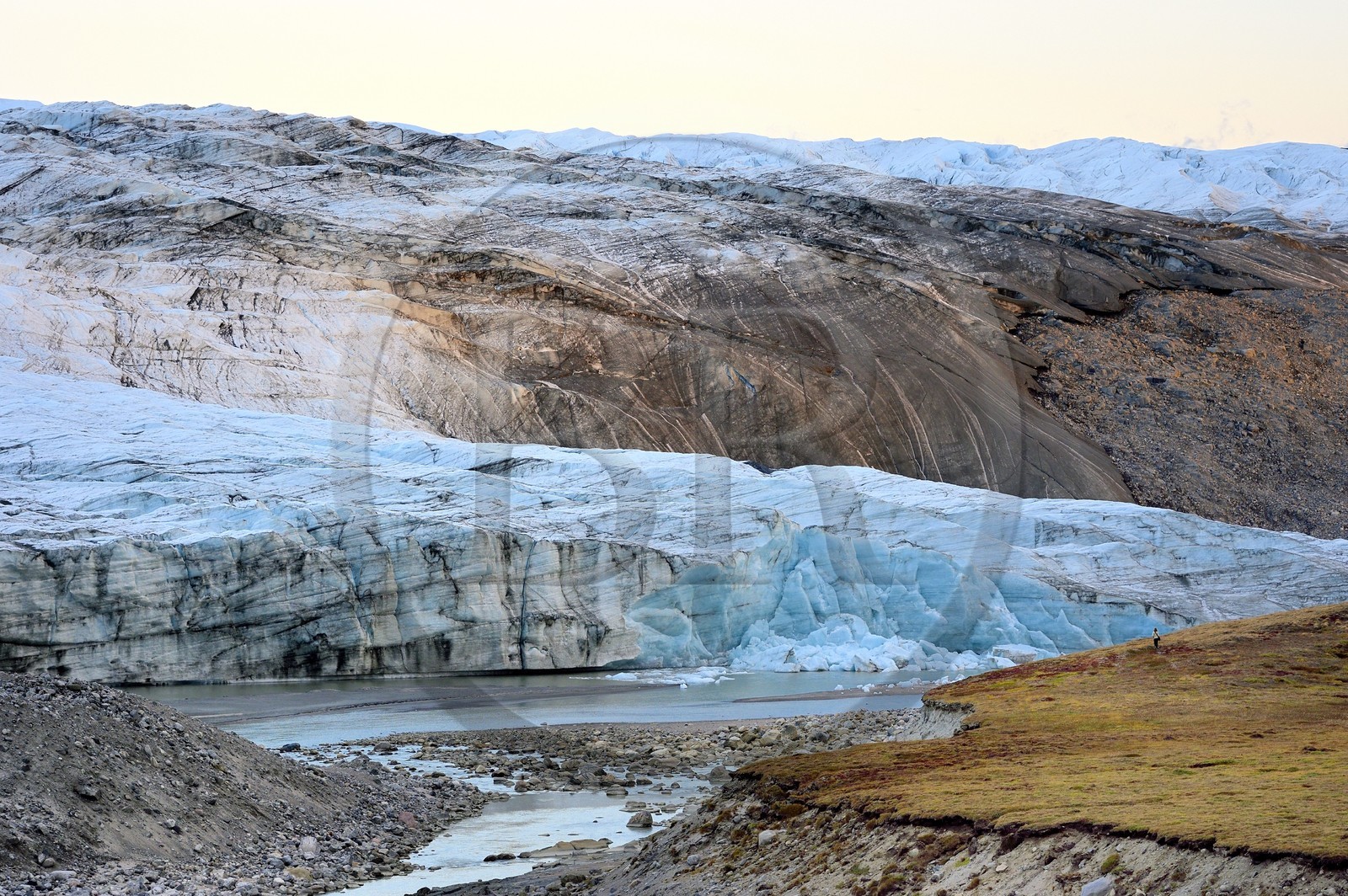 Greenland, central western region towards Kangerlussuaq bay, Isunngua highland, the Reindeer glacier (part of the Russell Glacier) at the edge of the ice cap and located within the UNESCO World Heritage site of Aasivissuit - Nipisat and hiker