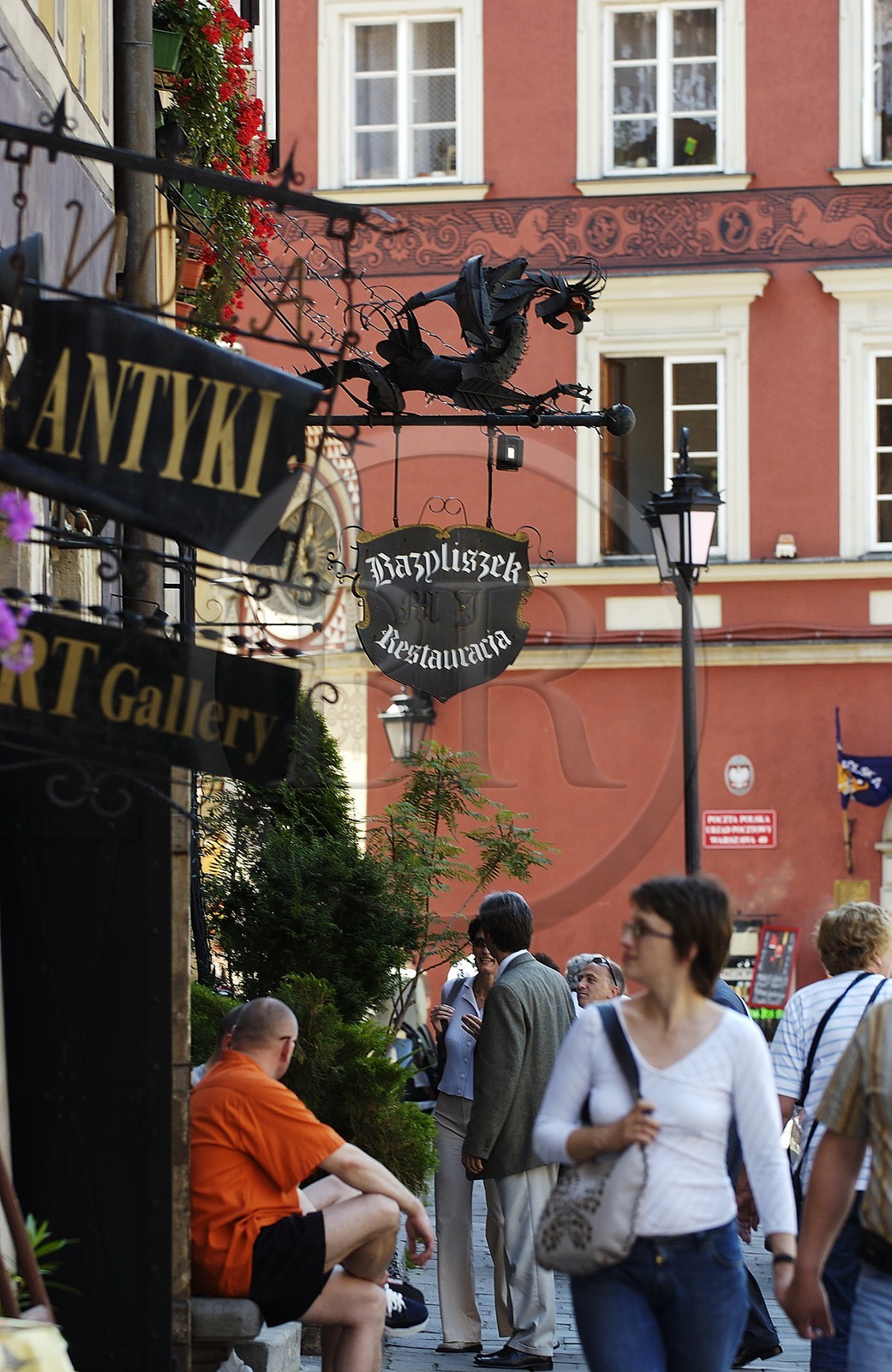 Poland, Warsaw, the dragon sign from the Bazyliszek restaurant in the old town