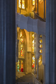 Spain, Catalonia, Barcelona, Eixample district, Sagrada Familia basilica by Catalan modernist architect Antoni Gaudi, listed as a UNESCO World Heritage Site, one of the two spiral staircases of the ambulatory giving access to the upper part of the choir, the interior the facade of the neo-gothic apse in the background