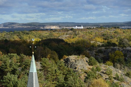 Sweden, Västra Götaland, Koster Islands, Sydkoster, the island church bell tower seen from the Valfjäll rock, Stromstad ferry and the mainland coast in the background