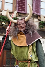 France, Haut Rhin, Strasbourg, Ribeauvillé, the medieval christmas market, one of the many characters in costume who criss-cross the village