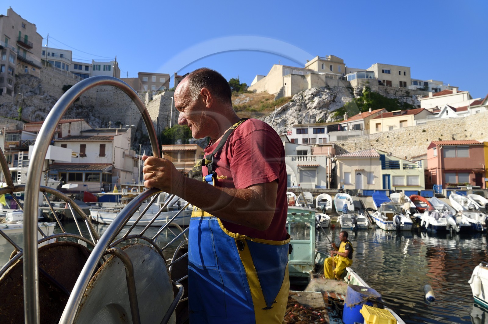 France, Bouches du Rhone, Marseille, Endoume district, Vallon des Auffes, Lucien Jativa is back from fishing and sorting fish