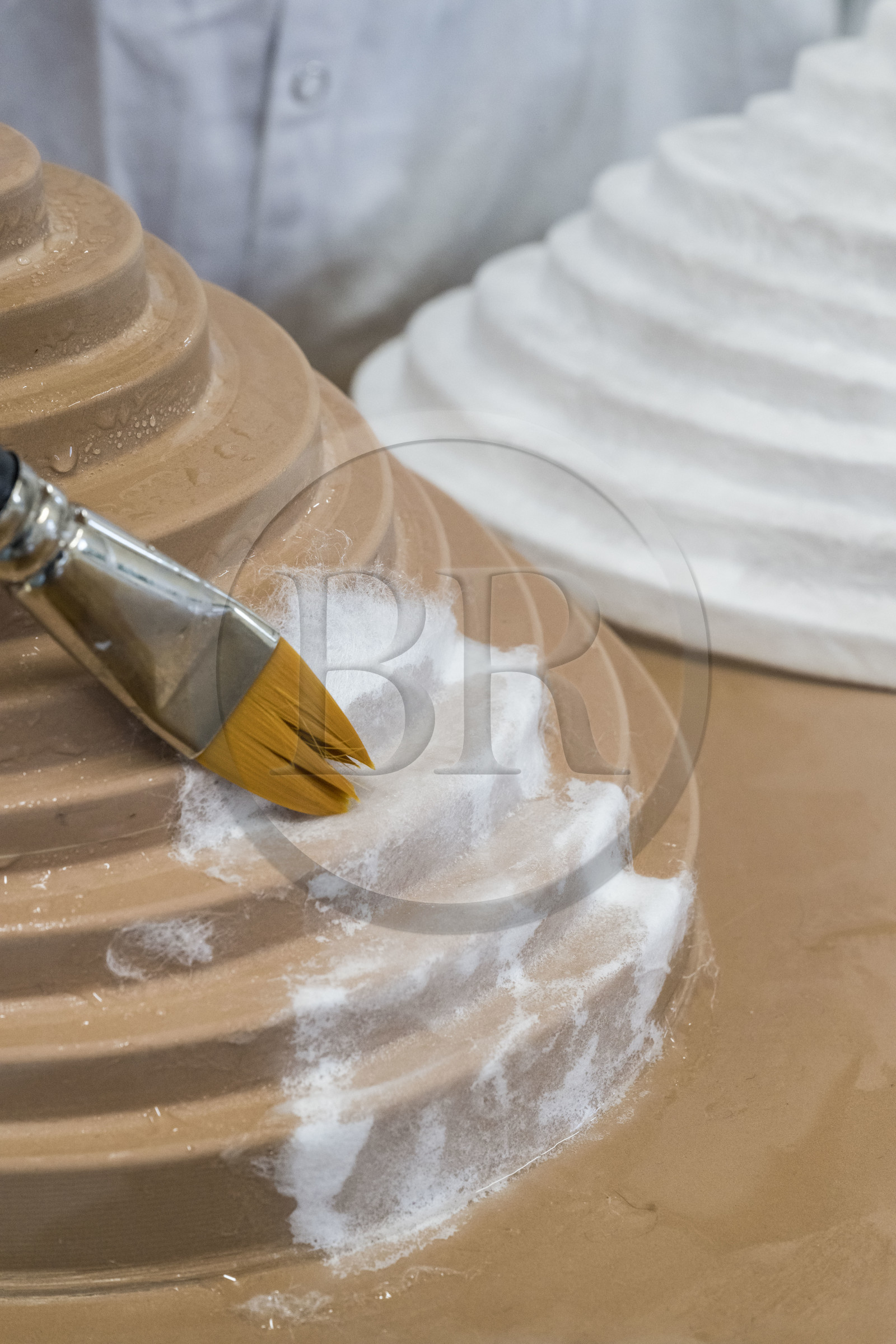 France, Gard, Bagard, Atelier Sericyne, production of exceptional and non-woven silk for the creation of decorative and lifestyle objects in silk, placement of a piece of silk threads on a mold with brush and water application