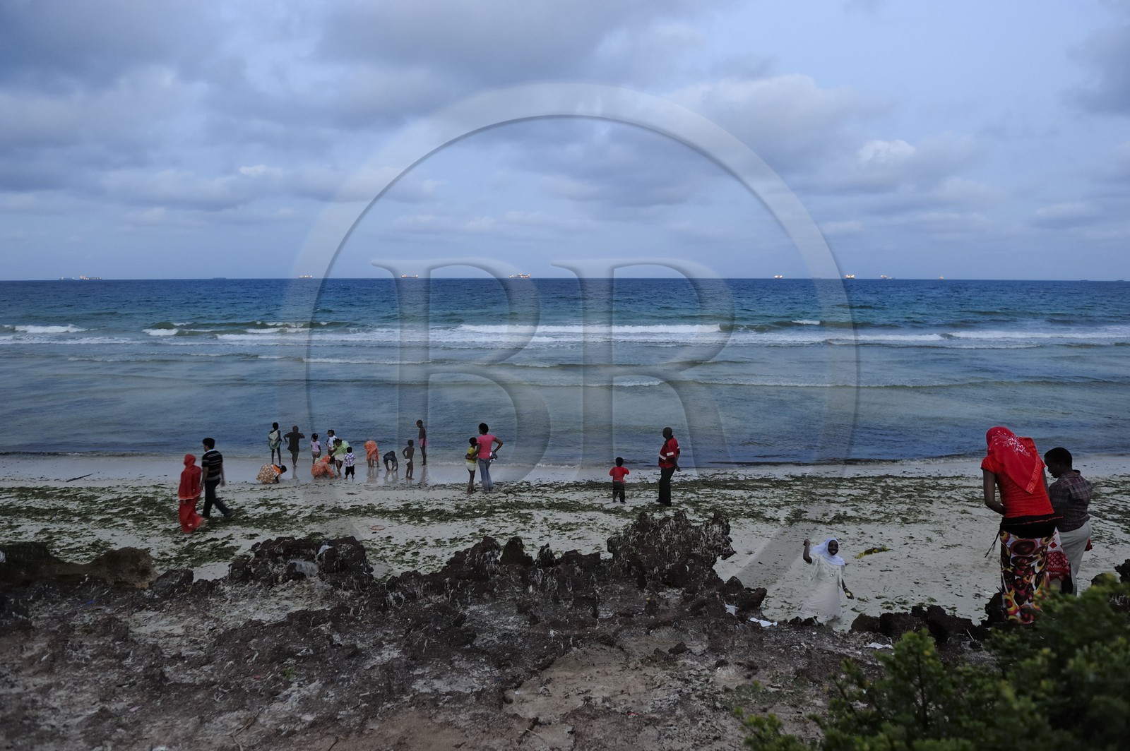 Tanzania, Dar es-Salaam, there is still lot of people at Coco Beach at dusk on Sunday