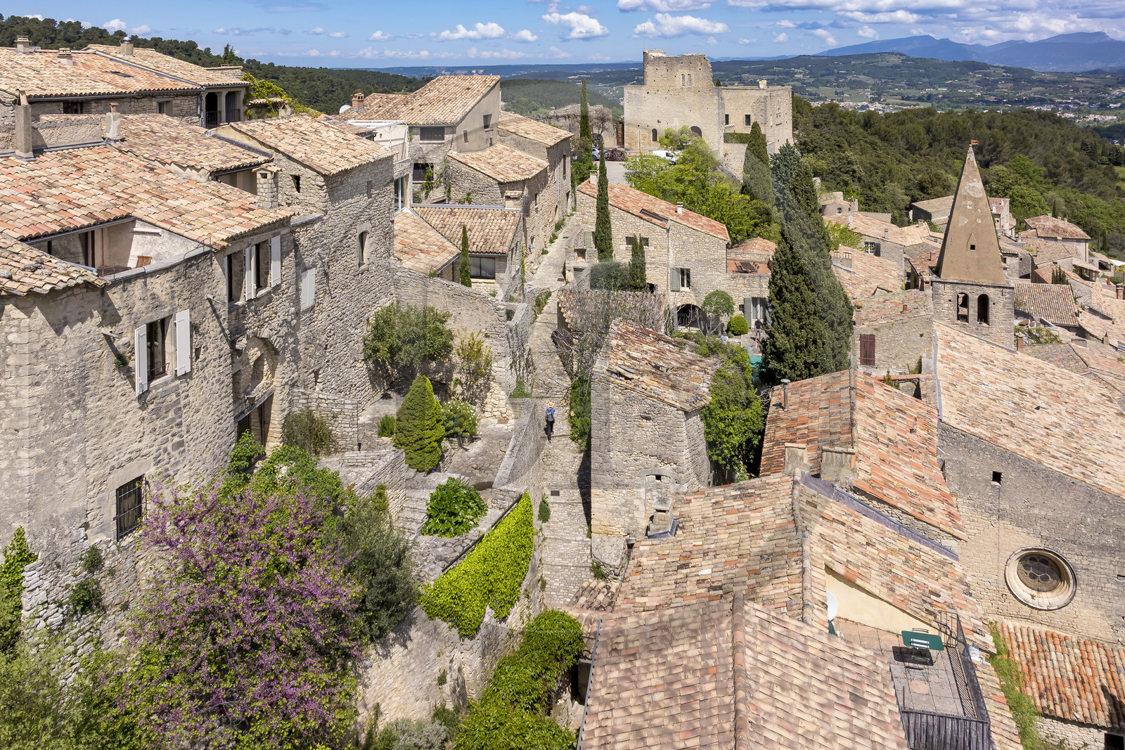 France, Vaucluse, Dentelles de Montmirail mountains, Crestet, the hilltop village of Crestet and its 9th century castle (aerial view)
