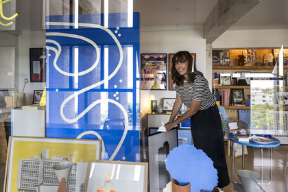 France, Bouches du Rhone, Marseille, architectural work of Le Corbusier, listed as World heritage by UNESCO, the Cité Radieuse by the architect Le Corbusier, the ambulatory between the 3rd and 4th floors and its shops, Laura Serra Forest, co-founder of Kolektiv, Kolektiv 318 gallery and boutique focused on architecture and design