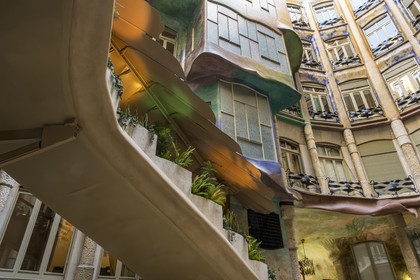 Spain, Catalonia, Barcelona, Eixample district, Passeig de Gracia, Pedrera or Casa Mila (1905-1910) by the Catalan modernist architect Antoni Gaudi, UNESCO World Heritage site, main staircase in the big courtyard