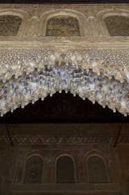 Spain, Andalusia, Granada, Alhambra Nasrid Palace, listed as World Heritage by UNESCO, Comares Palace, from the northern gallery of the Court of the Myrtles (Patio de los Arrayanes) through a pointed arch of mocarabes entering into the Hall of the Boat (Sala de la Barca)