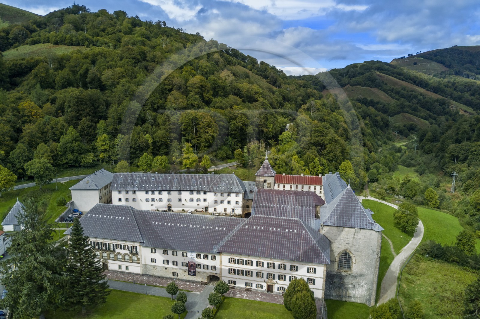 Spain, Basque Country, Navarra, Roncesvalles, stop on the Camino de Santiago (the Way of St. James), Royal Collegiate Church of Roncesvalles (aerial view)