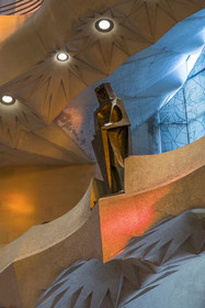 Spain, Catalonia, Barcelona, Eixample district, Sagrada Familia basilica by Catalan modernist architect Antoni Gaudi, listed as a UNESCO World Heritage Site, the bronze statue of Saint George (Sant Jordi) by the sculptor Subirachs in the center of the interior of the facade of Glory