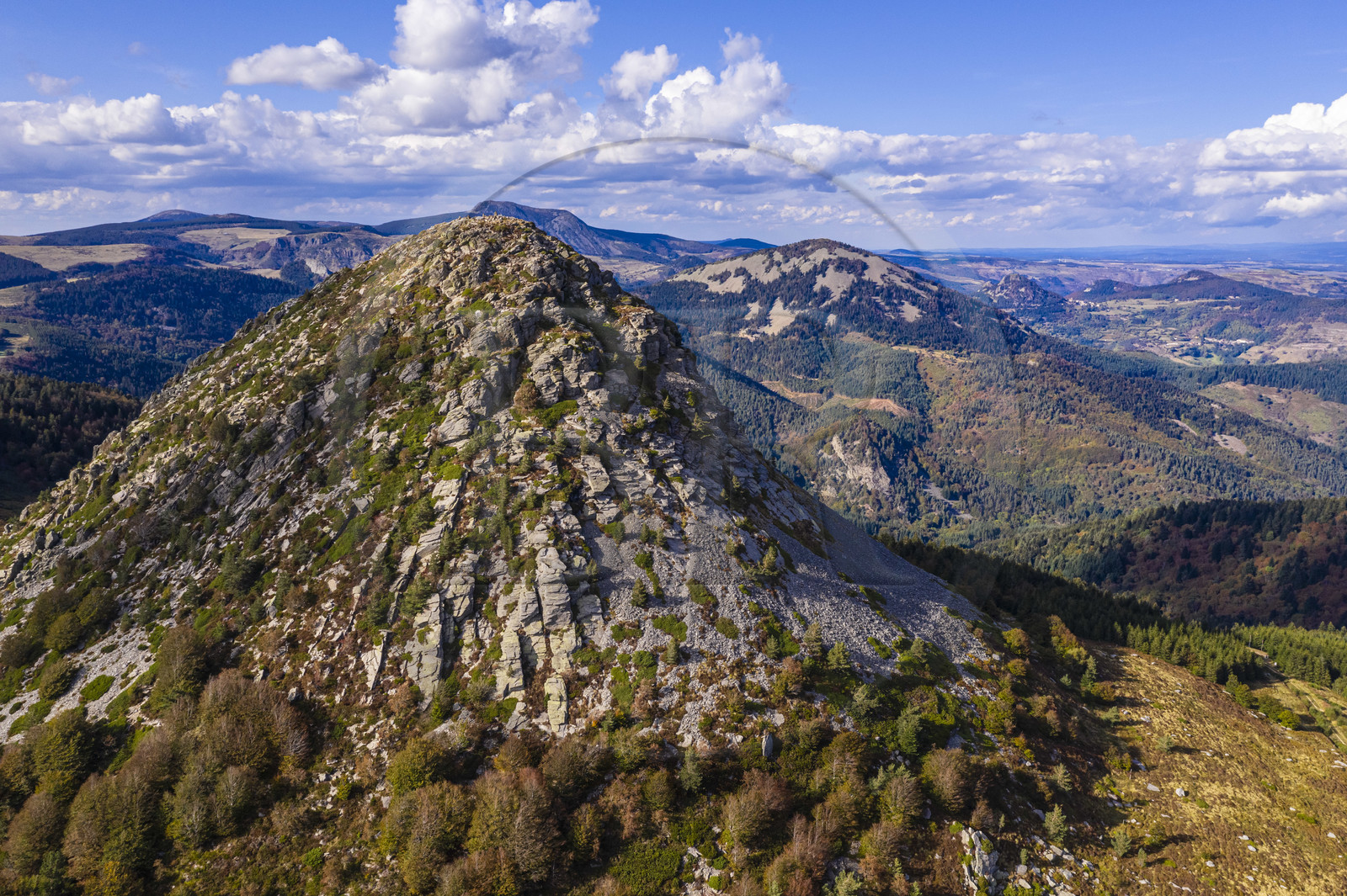 France, Ardeche, parc naturel regional des Monts d'Ardeche (Regional natural reserve of the Mounts of Ardeche), Mont Gerbier de Jonc (altitude of 1551m), source of the Loire river, the Suc de Sara mountain in the middle distance and the Roches de Borée mountain in the background (aerial view)