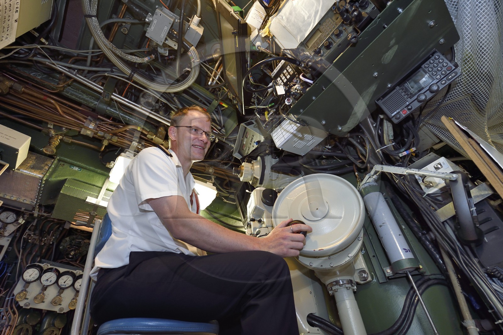 France, Var, Toulon, the naval base (Arsenal), Commander Nicolas Faure at periscope in the central navigation and operation room, Commander of the nuclear attack submarine (SNA) Casabianca (Rubis type)