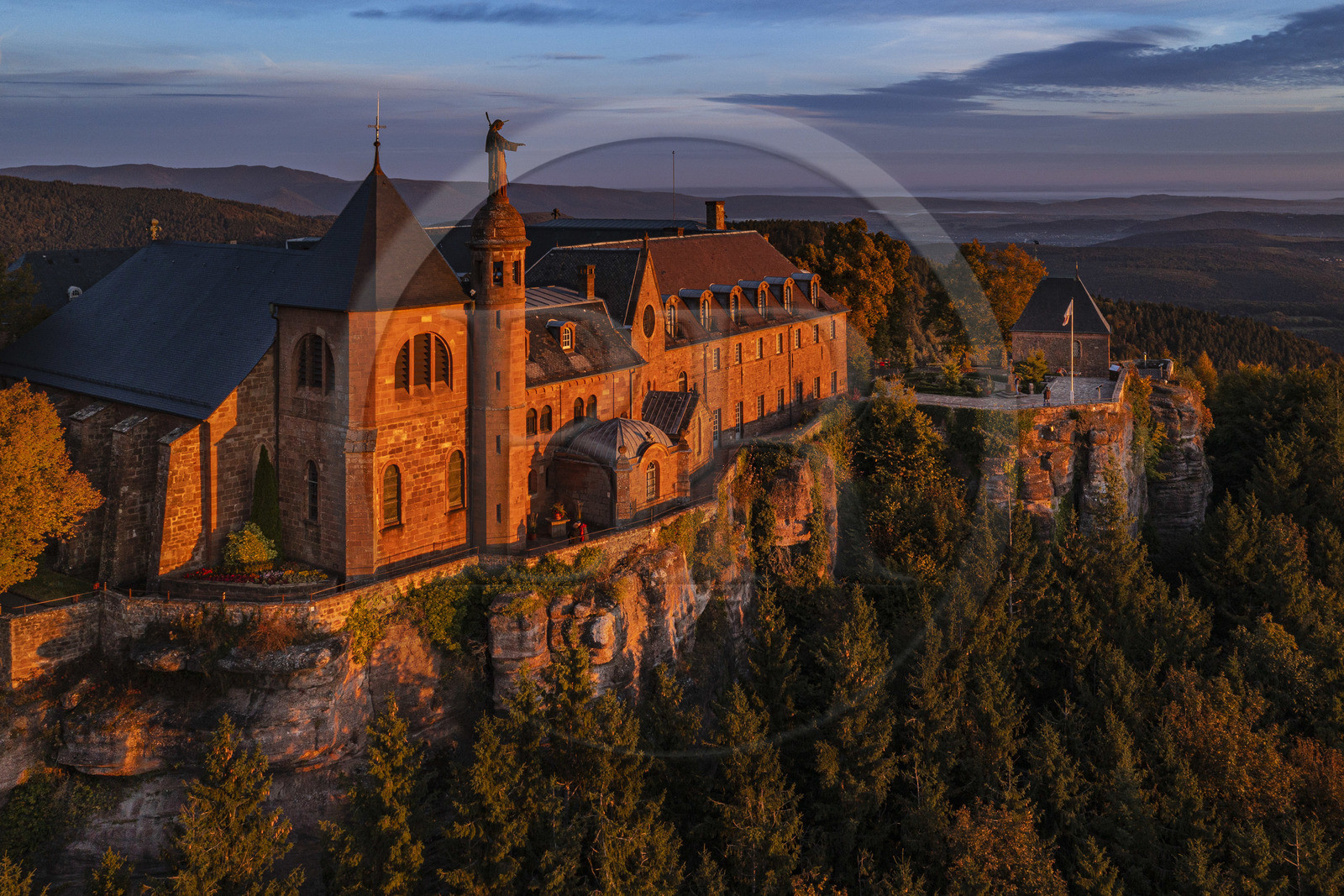France, Bas-Rhin (67), Mont Saint-Odile, abbaye de Hohenbourg encore appelée couvent du Mont-Sainte-Odile, statue de Sainte Odile placée sur le toit du couvent et faisant face à la plaine d'Alsace (vue aérienne)