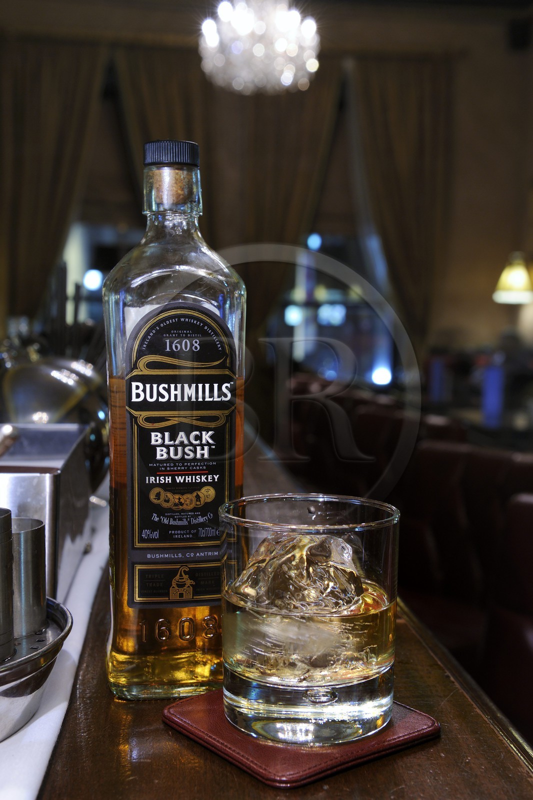 United Kingdom, Northern Ireland, Belfast, The Merchant Hotel bar in a former bank, bottle of Bushmills whiskey